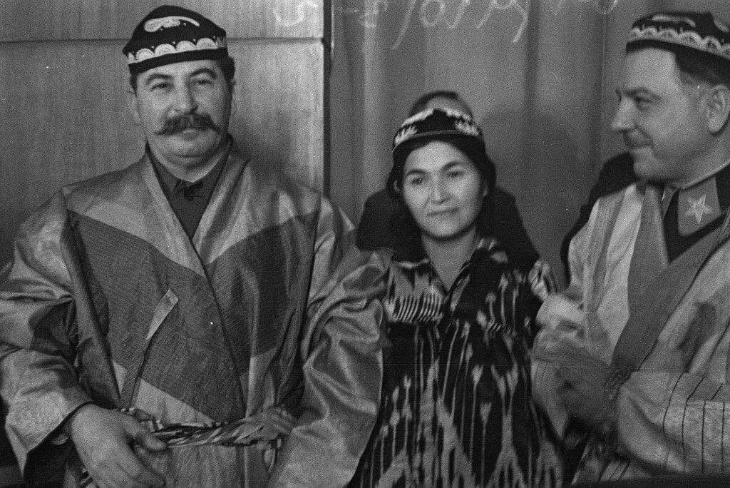 Joseph Stalin in Tajik national costume in the Kremlin during a meeting with leading collective farmers of Tajikistan. Moscow, 1935