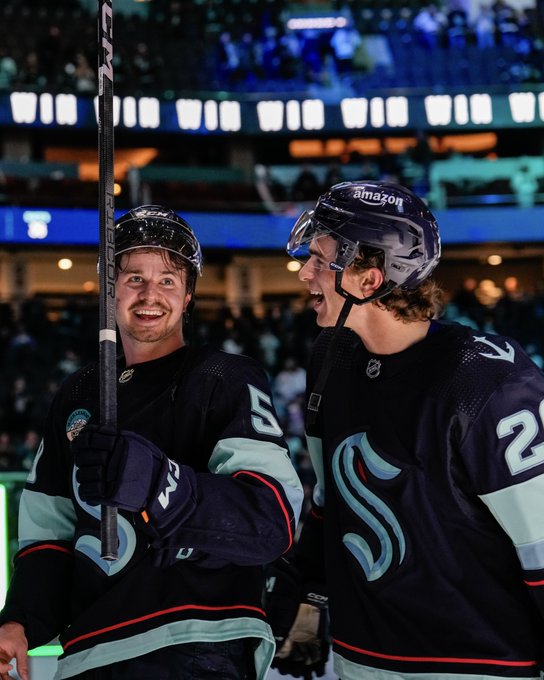 seattle kraken rookies logan morrison and ryan winterton smiling after victory at home