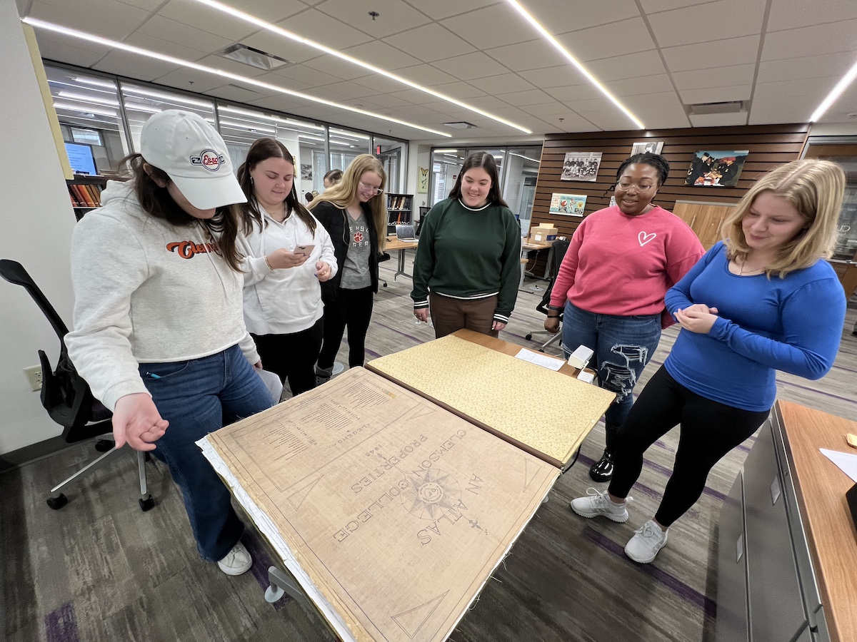 CUCemetery's tweet photo. The CI Team recently visited the campus archives again to learn about records for Clemson employees and to explore historical maps, including an atlas of campus made in 1945. @ArchivesClemson https://t.co/2UdrxueUiX