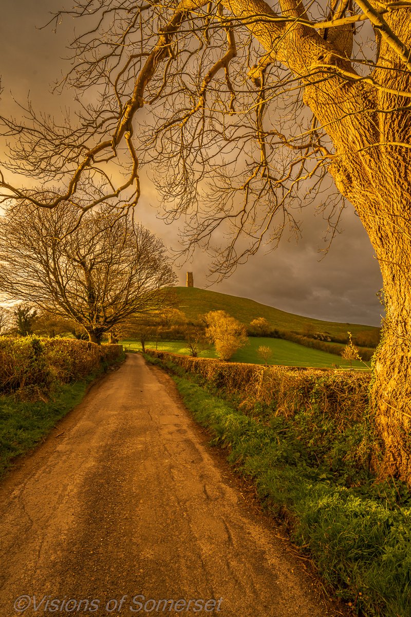 Just at that final moment before the sun disappeared and the rain and hale took over. the light was just so intense. Glastonbury Tor this morning.