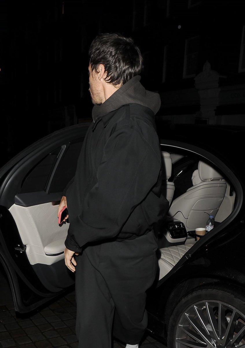 Harry leaving a party for the England Football team at 4AM.