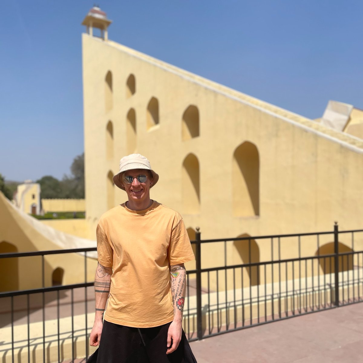 The world’s largest sundial: the Vrihat Samrat Yantra at Jantar Mantar in Jaipur (accurate to 2 seconds). The sundial is 27m high, and has an angle of 27 degrees - the latitude of Jaipur - which makes the hypotenuse approximately 10% longer than the base. What are their lengths?