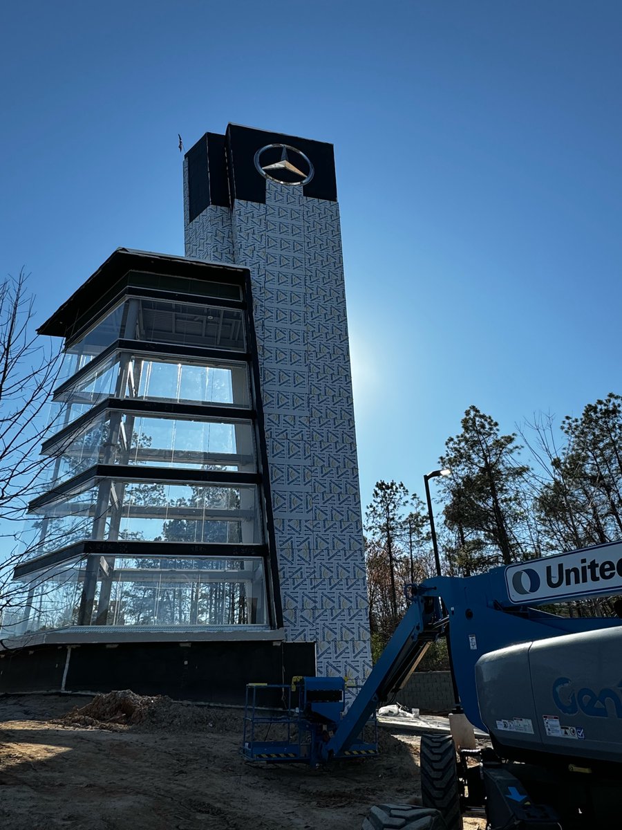 Constructing a custom 100-ft-tall car tower near Atlanta for Jim Ellis Mercedes. Meticulous attention to detail & unparalleled craftsmanship define our panel installation. #ThePanelGuys #ConstructionExcellence #FieldInstallation #AtlantaConstruction #Craftsmanship