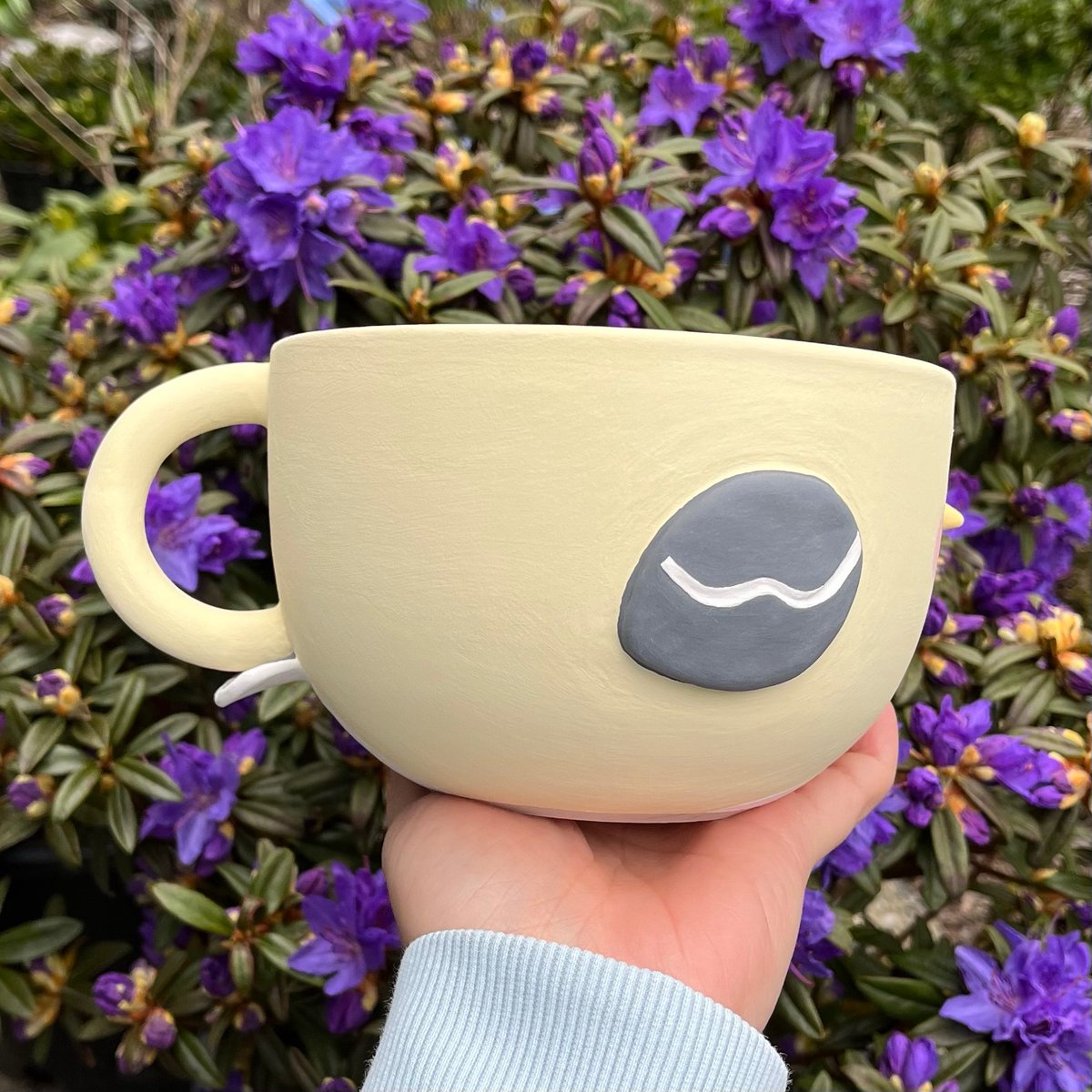 isopaws_studio's tweet photo. Pictures of these borbs by flowers, will be part of our spring collection drop! 🪻🐤💛 soon to be bisque fired!

#pottery #borb https://t.co/LaEgL0DAYW