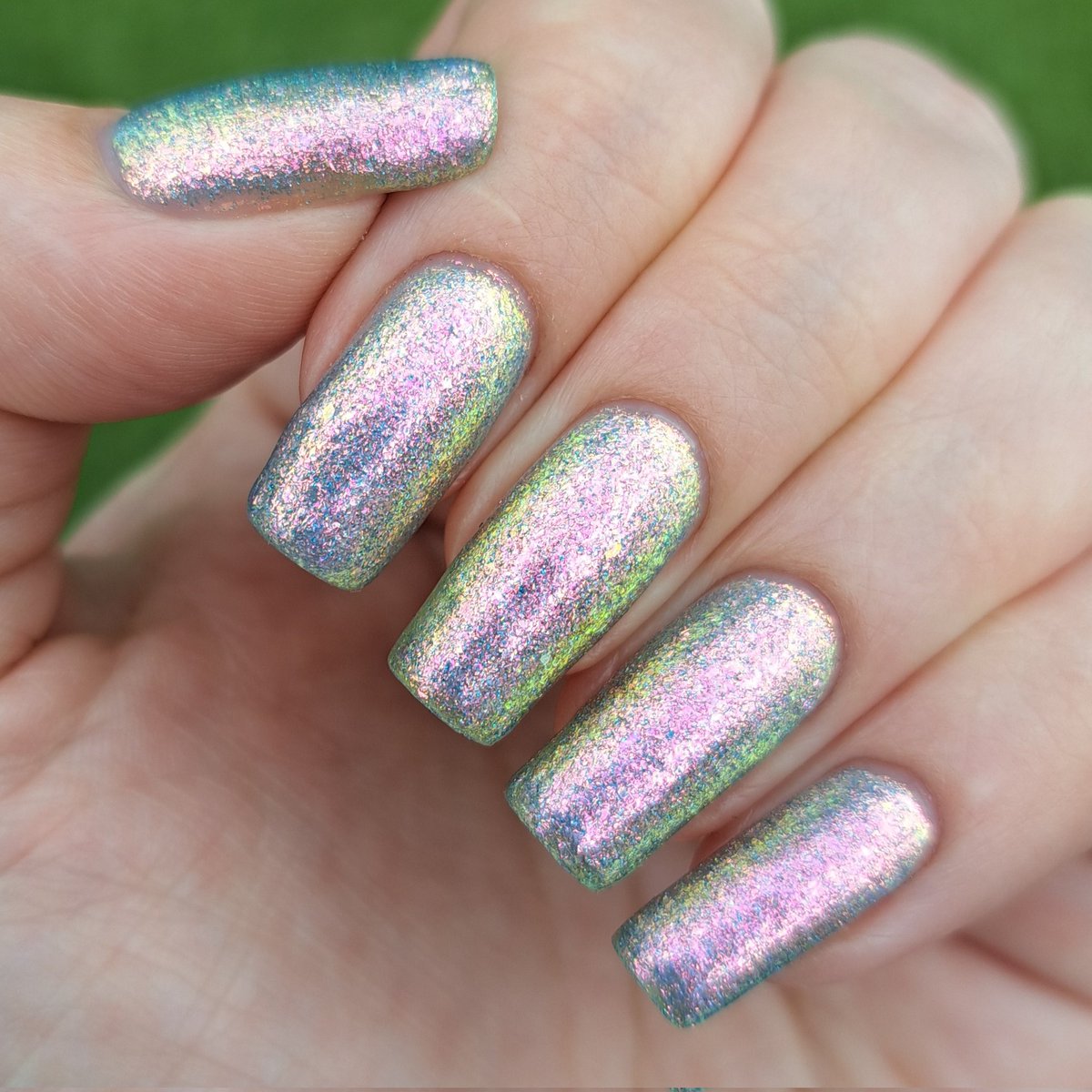 givemesparkles's tweet photo. This week's polish: 'Just The Coolest' from @kbshimmer's Best In Snow collection is a pale periwinkle jelly base packed full of mirco shimmer flakes that shift through pink-peach-gold-lime-blue, plus a dash of holo glitter.  🩵✨️💅 #kbshimmer #indienailpolish #givemesparkles https://t.co/9QjRZbv7i3