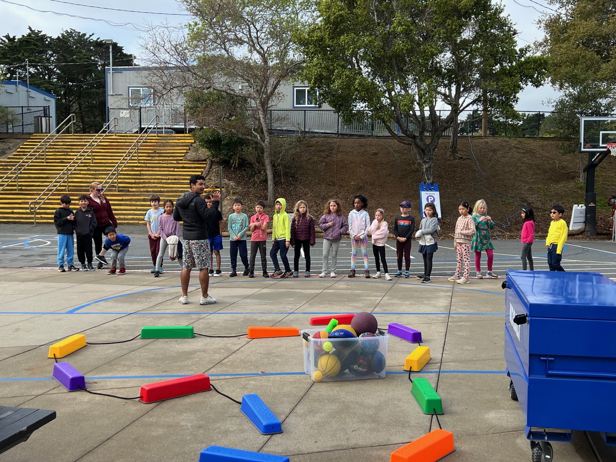 #SeenAtNueva: As the construction barriers come down around the new Humanities Center (opening soon!), the Hillsborough campus sports court is back in business! Spotted: 2nd grade students in PE block with Lower School PE teacher Zubin Mobedshahi ’03.