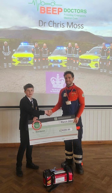 BeepDoctors's tweet photo. Dr Chris Moss met with Tom Taylor during an assembly at @ullswatercc early today. Tom's incredible effort - raising over £6,000 for our charity with a 24-hour-running-with a-kayak challenge before Christmas - is testament to great community support! #volunteers  #Doctors https://t.co/fSMP04si1V
