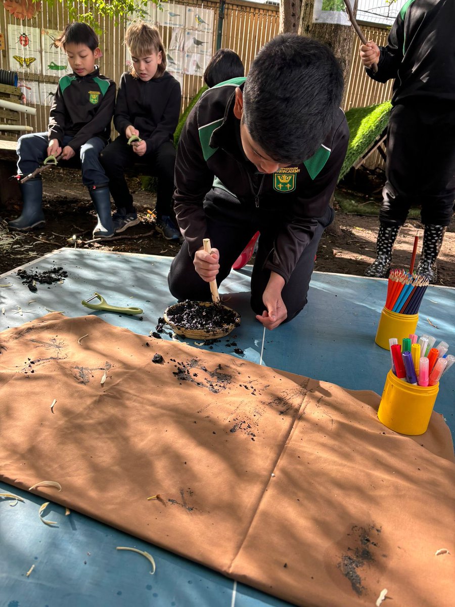 An exciting day at Forest School for year 5 today @cheamparkfarm 🌲 The children got hands-on with nature, whittling their own pens using potato peelers. Turning campfire ashes into ink, they designed a one-of-a-kind forest camp flag 🚩 Creativity meets sustainability!