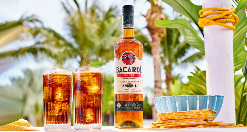 Is it too early to go to the beach yet? Well, with us, every party is a beach party. #BACARDI Spiced & Coke© -1 ½ BACARDÍ Spiced Rum -3 parts Coke© #DoWhatMovesYou