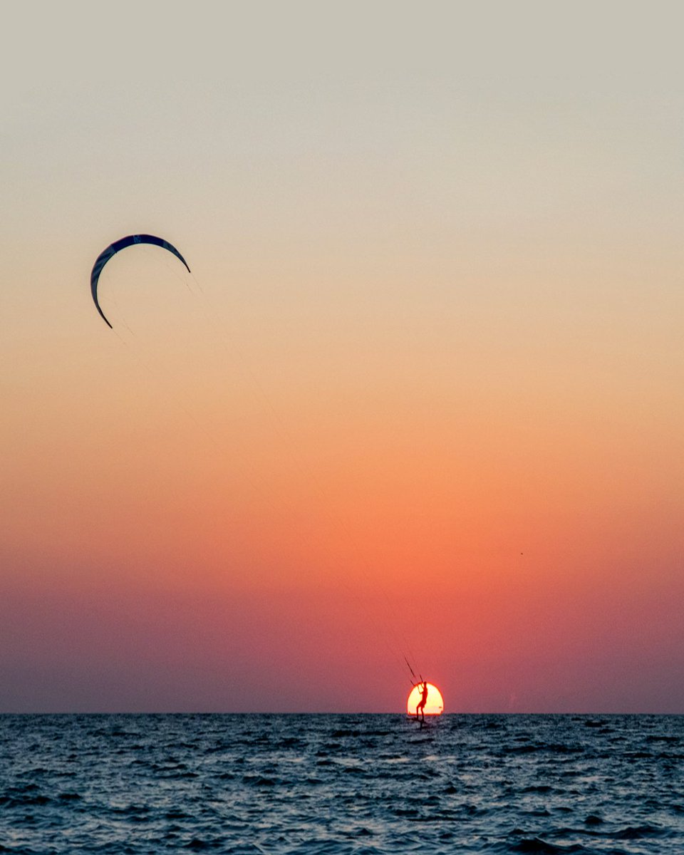 Catching waves (and dreams) at golden hour. 🌅🪁 #BradentonArea #AnnaMariaIsland