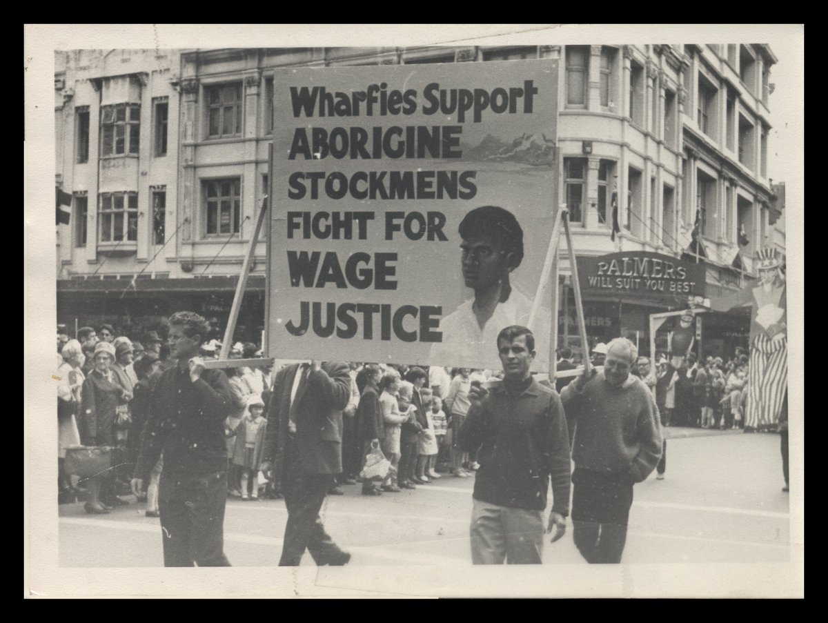 'Wharfies support Aborigine Stockmen's fight for wage justice.' Waterside Workers' Federation Banner at a May Day Procession in Sydney, 1966.