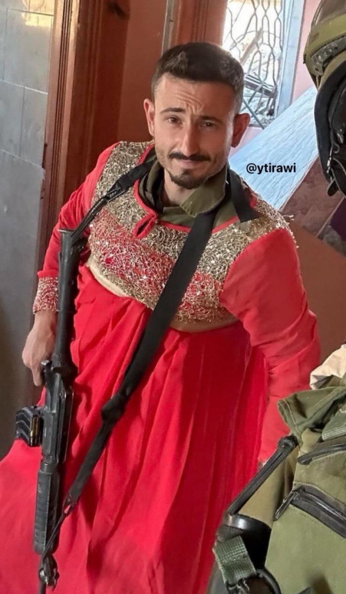 Bayan_Alyassin's tweet photo. @MrBeast Israeli terrorist posing in a dress he stole from a Palestinian woman he killed or displaced. 

This is what tax money is funding. https://t.co/tuo2OMNMqD