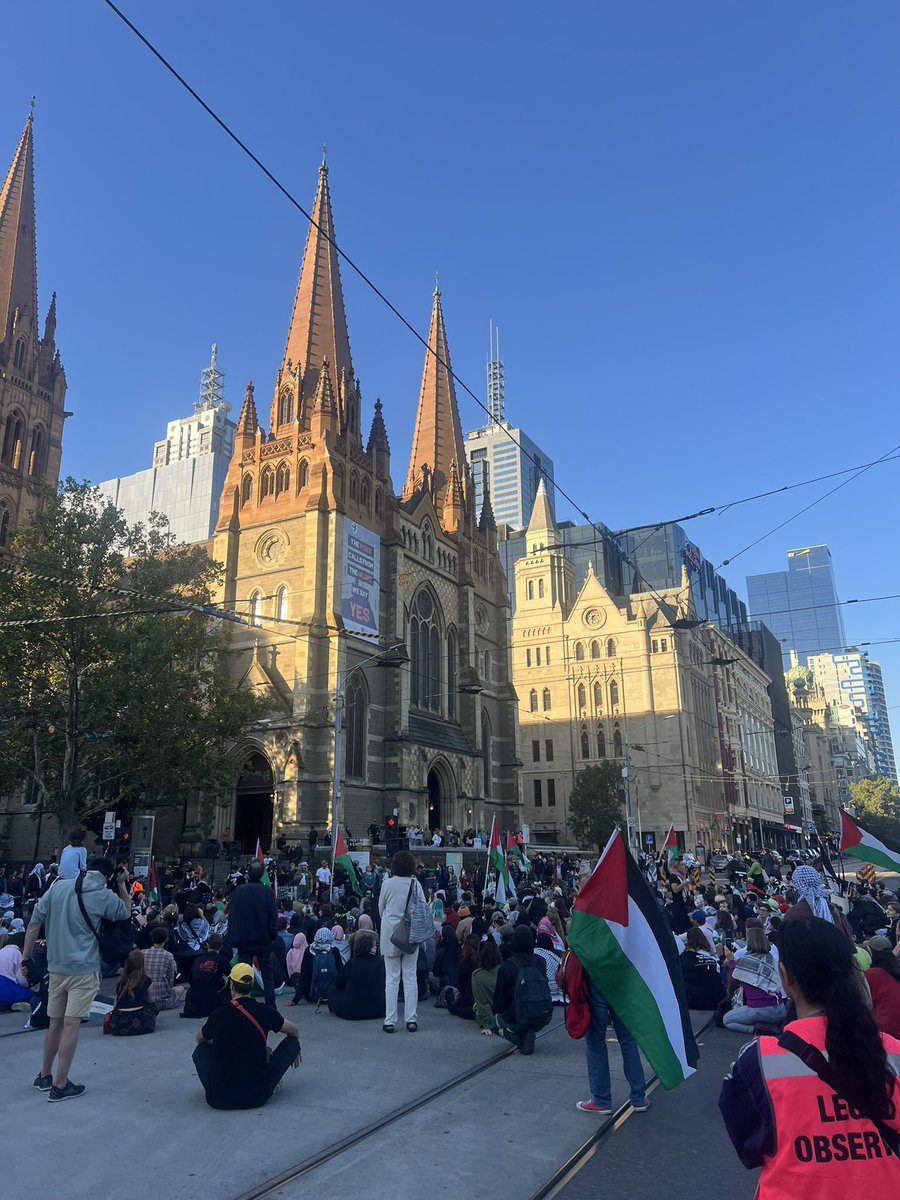 Free Palestine protestors blocking off Flinders and Swanston street on Good Friday Eve. Big line of trams banked up down St Kilda road