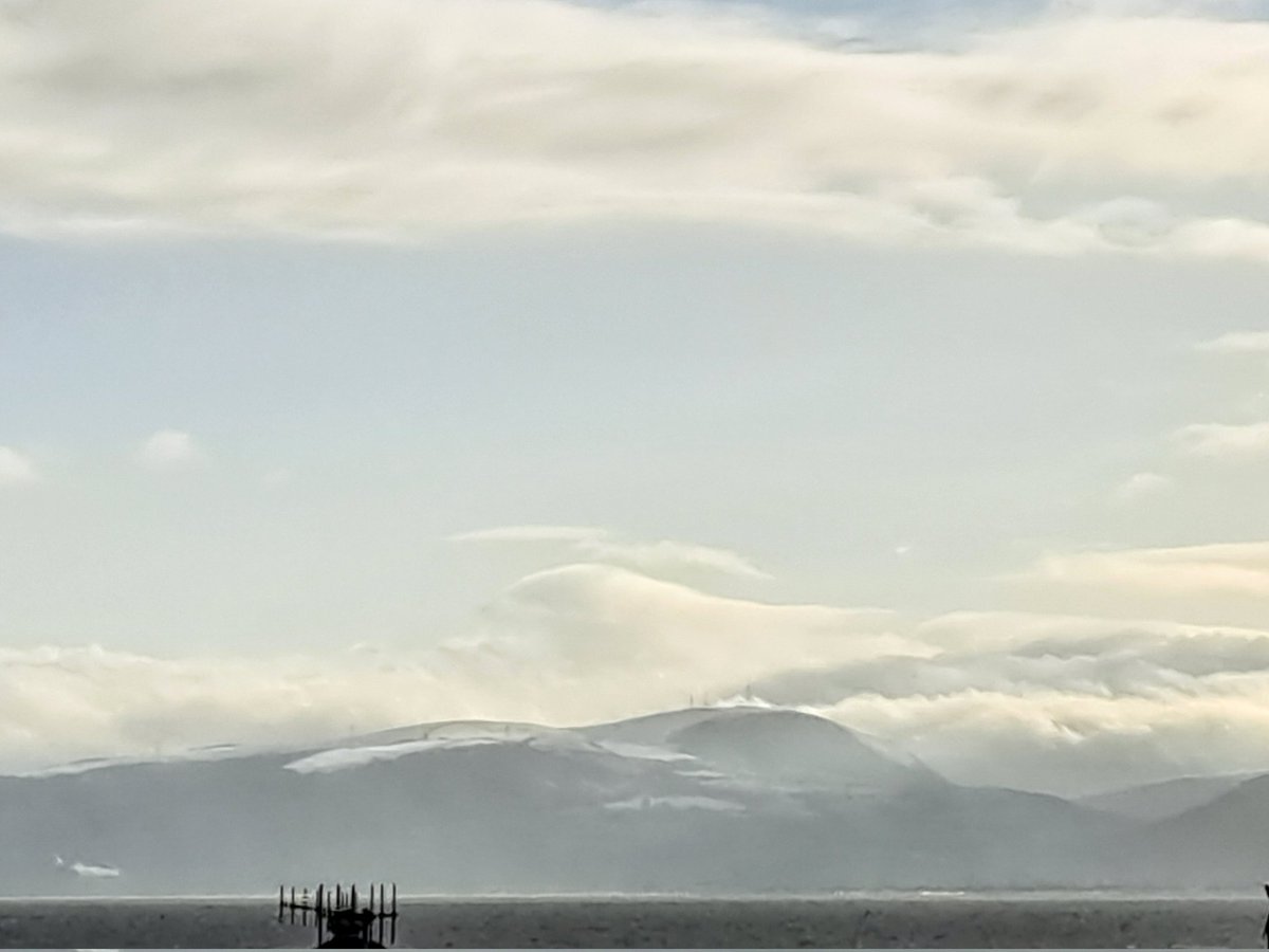 A sun-silver sea and snow on the distant hills. A blowy, bracing, beautiful start to the day. Happy Thursday, everyone! #thursdaymorning #walking #beach #inspiration #books