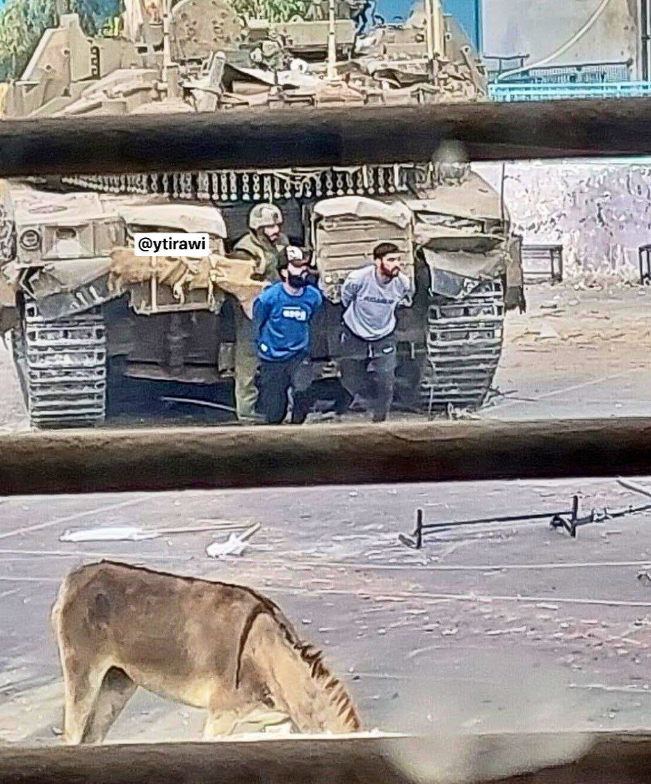 Israeli soldiers have posted this picture on social media that shows them openly taking Gazans as human shields to protect their tanks.#GazaGenocide #Rafah #GenocideJoe #NatanyahuCriminal #israelterroriststate #Gaza #JusticeForPalestine #ISISisIsrael