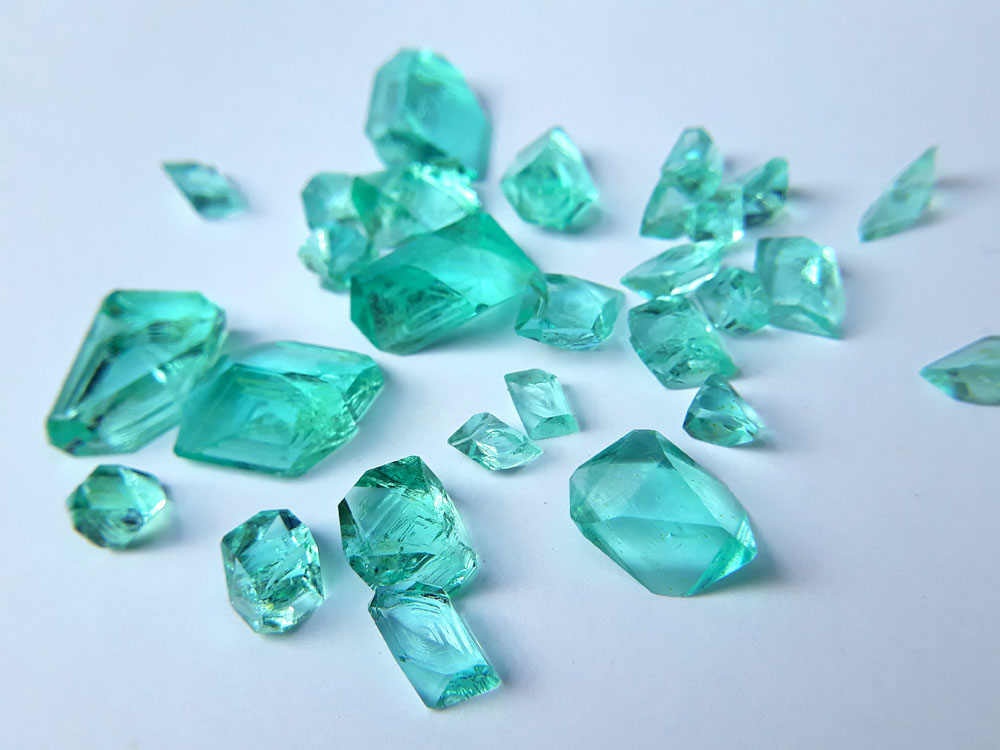 Iron(II) sulfate heptahydrate FeSO₄ • 7H₂O These crystals really look like pieces of blue-green glass.