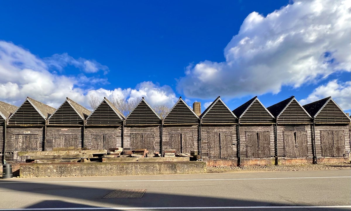 #AlphabetChallenge #WeekS - 'S' is for Sheds with Shadow and Scudding clouds Unique survior of a once more common building type, the timber seasoning shed, redundant with the introduction of iron ships.These are at Chatham and date from 1771. Gd II* listed. #woodensday