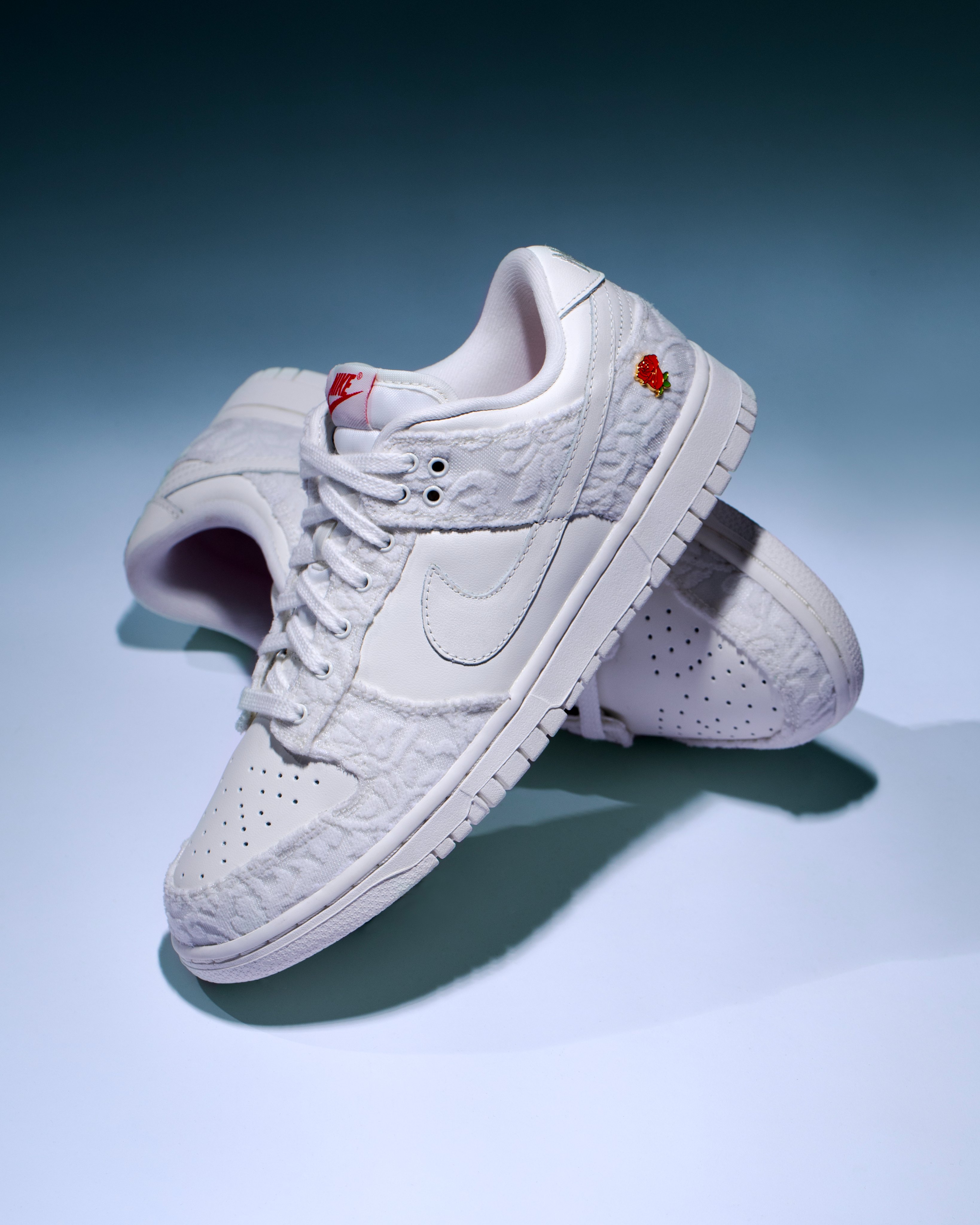 KICKS CREW on X The Nike Dunk Low Give Her Flowers features an off white leather upper complemented by floral print knit overlays with a molded rose pinned to the heel. Shop Now