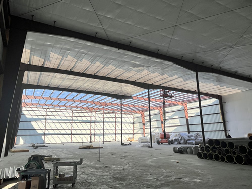 Despite windy conditions (tough to install roof panels) we're making good headway at the Hasty Awards project. Roof is nearing completion, insulation system is underway, &amp; walls to the hardened shelter are complete &amp; ready for concrete cap. Randy Frahm is superintendent.