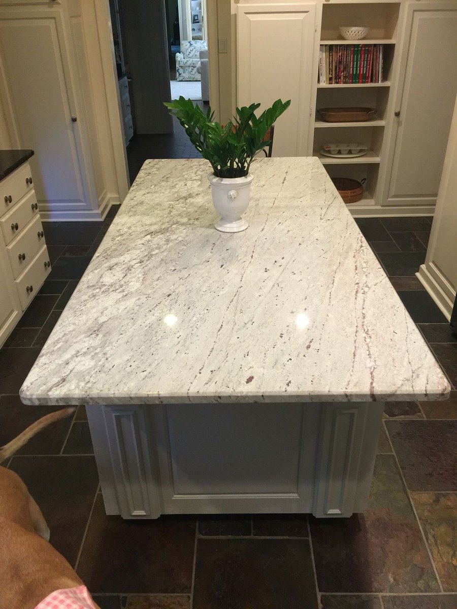 ⛰️ Transform your kitchen with the classic allure of River White Granite countertops! ✨ Infuse your living space with the captivating textures and hues inspired by nature. 🏡 Who else is enchanted by the charm of River White Granite? 💬