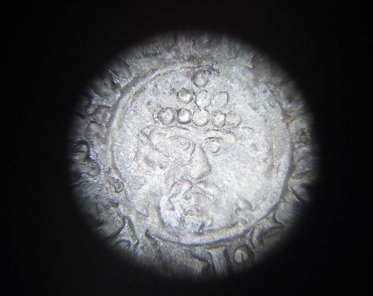 A little face revealed on this Saxon coin. He seems to be getting into the #Easter spirit with a hat made from eggs! Excavated @PCAarchaeology #microscope_photos #ArchaeologicalConservation #Archaeology #eastereggs #easterweekend