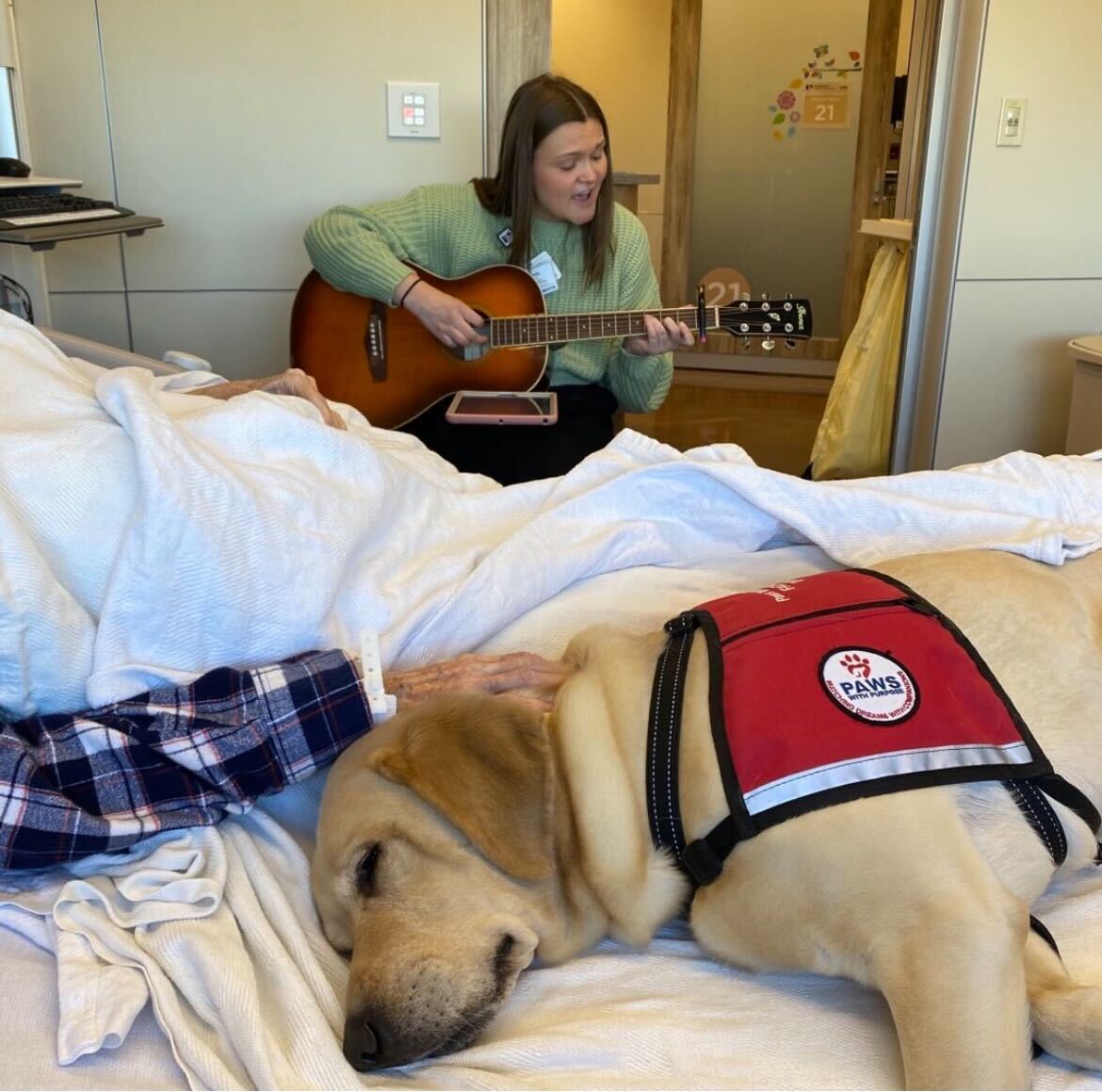 Bringing harmony to healing! 🎶🐾 Facility dog, Zeus and music therapist, Kennedy McCollam teamed up to offer comfort and support to this patient at Norton Cancer Institute. Together, they're wagging tails and lifting spirits, one beat at a time!