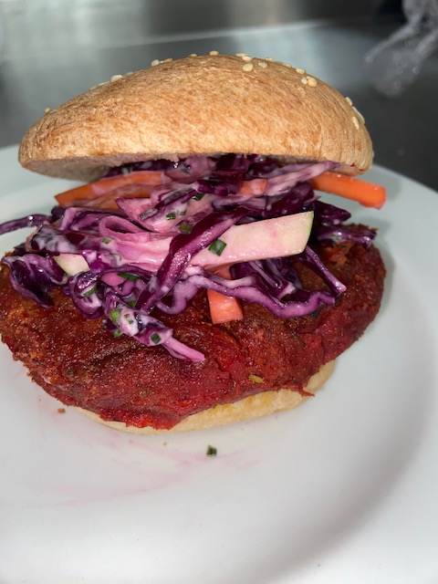 The @cofgcollege Bistro are the final restaurant taking part in our #beansonthemenu challenge this March. They're serving vegan lentil burgers with salsa, pickles, and coleslaw.