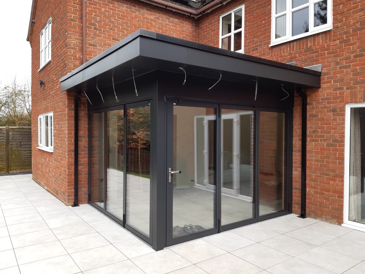 Two similar extensions ,slightly different choices. The thatched house in Dorset has #Cero slim-profile sliding doors in Chocolate Brown. The 2nd, a home in Staffs, has our slim #Solarlux Highline #bifoldingdoors in Anthracite plus aluminium cladding by ourselves. Both great!