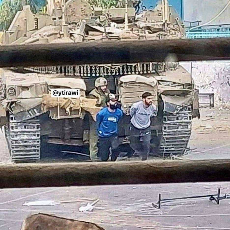 A photo showing the Israeli soldiers using Palestinian civilians as human shields in Gaza