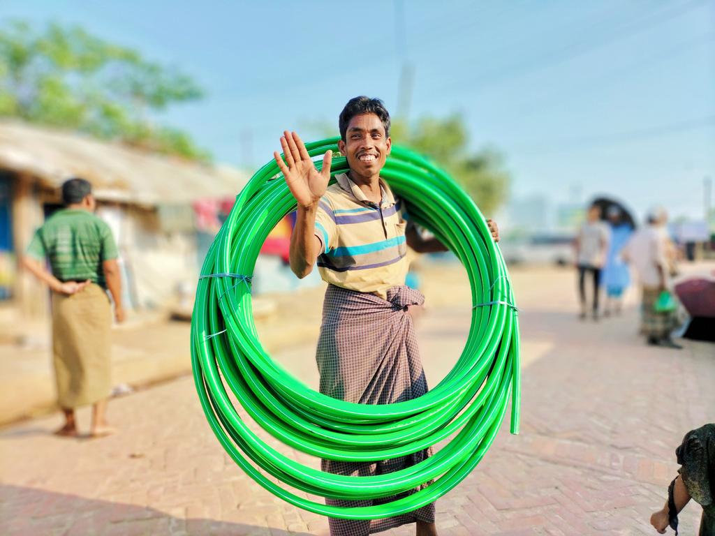 Anuwar_Sadek47's tweet photo. A #Rohingya man who is bringing a long pipe from the market and appreciating in capturing his picture and showing his joy in simple moment despite the challenges he faces.
#resilience
#rohingyalife
#labouring
#photograpylife https://t.co/6UzbDQuRqw