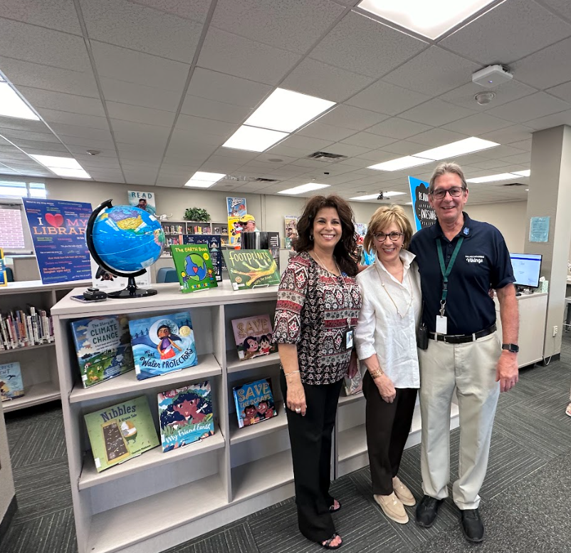 ggalligan's tweet photo. Principal Melissa Weinman and Dean Dennis Chartier celebrate a new Media Center with philanthropist Elsa of the Elsa Miller Foundation. New books, furniture, visuals, and a fun focus on literacy for all students! Thank you Elsa for your generous donation! @DVUSD @Village_Meadows https://t.co/xXMcMT7C0D
