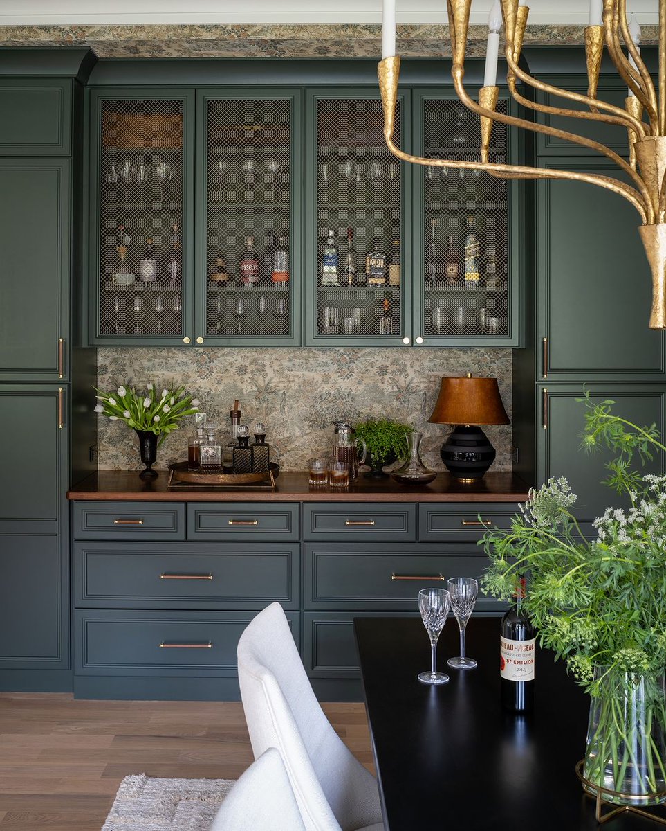 Celebrate in style. This custom bar by Liz Mearns is stocked with all the essentials for hosting the perfect dinner party. Featuring G.P. & J. Baker's Ramayana Wallcovering Photographer: John Cole Photo