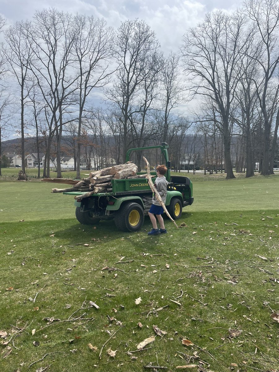 I got a little help this afternoon since he only had a half day of school today before Easter break. Cruising in the @FinchTurf Gator, listening to country music, and throwing sticks on a 🔥, doesn’t get much better! Thanking God for moments like these