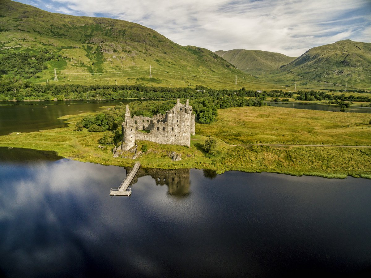 Loch Awe, located in Argyll and Bute, Scotland, is the longest freshwater loch in Scotland, stretching approximately 41 kilometers (25 miles). It is renowned for its stunning natural beauty, surrounded by lush greenery and rolling hills.