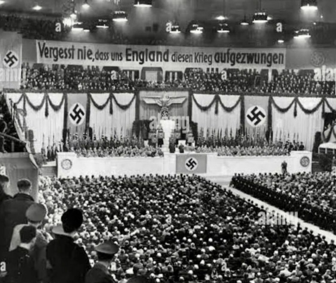 Goebbels speaking in Berlin on February 18th, 1943 The banner hanging over him says: “Never forget that England imposed this war on us' Goebbels in 1943 Putin today