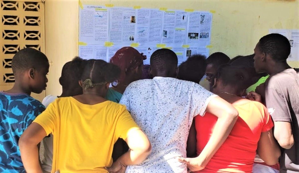 Photo just in from Port-au-Prince showing Haitians checking this morning's news to see if DeSantis has withdrawn his Haitian Invasion personnel. Said one man, 'We can get past CBP, DHS and the U.S. Coast Guard but I'm not invading if FWC & FHP are still in Islamorada.'