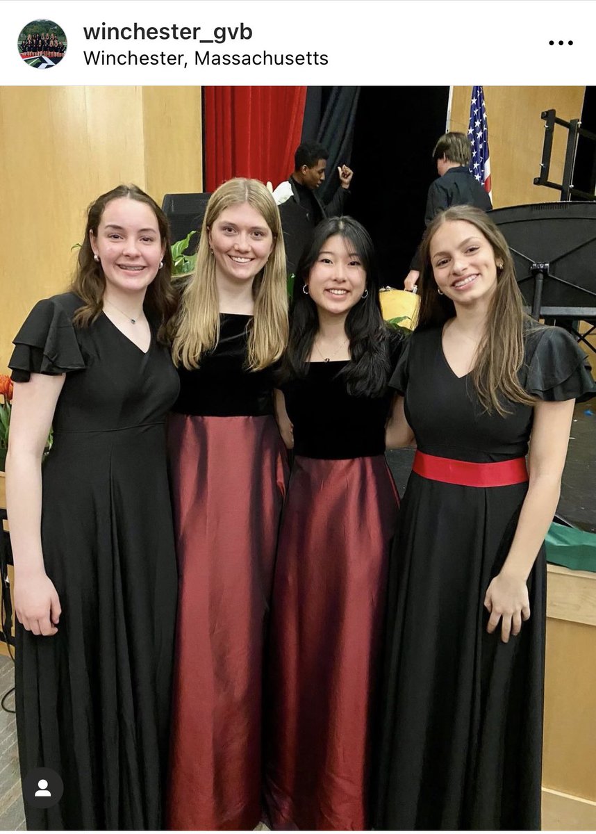 Apologies for the hard to see photos!  The stage looked gorgeous with spring flowers and the kids sounded amazing!  Can you see that Mr. B was wearing a boa?  Last photo cred Coach Fleming (singing and volleyball go together!)