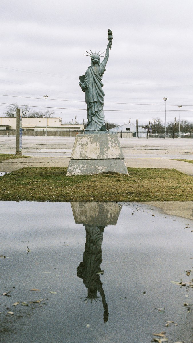 Somewhere in @fairparkdallas on a cold January day. Pretty sure I'll need this pic for after #electionday2024. Taken with Pentax 645n on Kodak NC 400 220 film (expired). #statueofliberty #statue #america #unitedstates #filmphotography #filmtography #parkinglot
