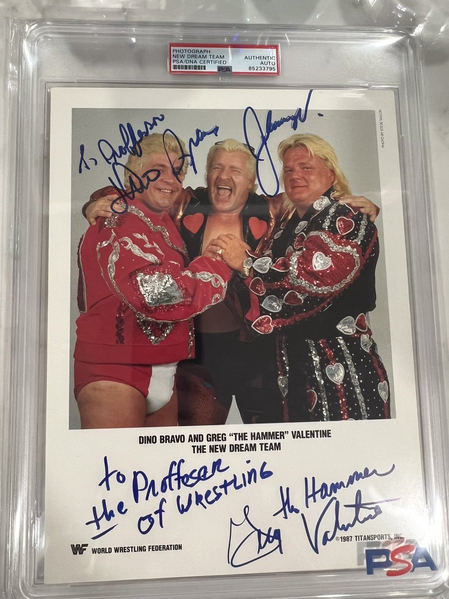 Just got back this extremely rare signed promo by Dino Bravo, Greg Valentine, and Johnny Valiant. It always looks so good in a fresh PSA slab 💪 #dinobravo #gregvalentine #johnnyvaliant #wwe #wrestling @CardPurchaser @Tweet_Wrestling @PSAcard @DarkSideOfRing