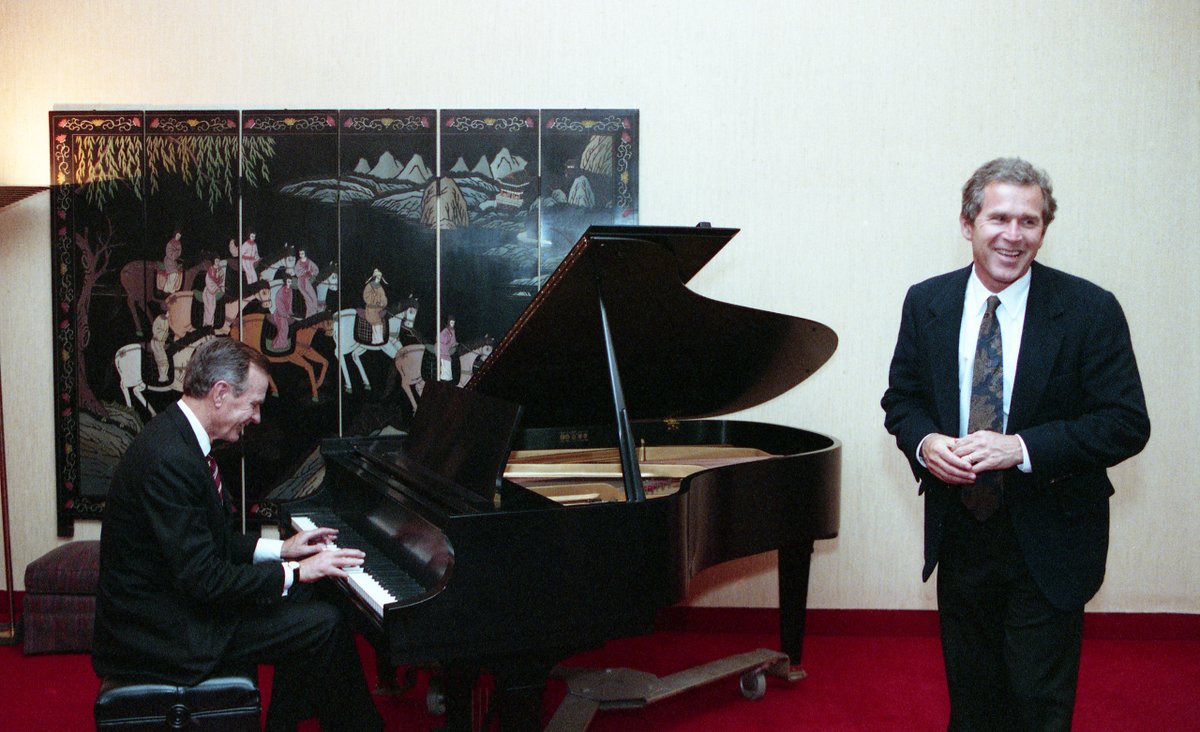 President Bush plays the piano for George W. Bush while waiting to greet Anne Murray following her performance at the Kennedy Center, Washington, DC. 07 Apr 92   Photo Credit: George Bush Presidential Library and Museum #bush41 #bush41library #bush41museum