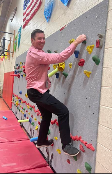 Mike Vagedes tries the climbing wall. 