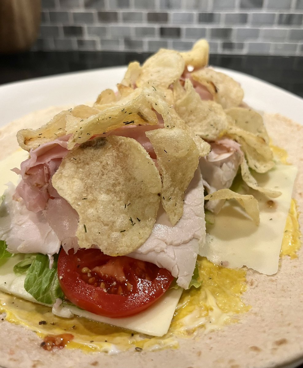 Lunch today. A nod to childhood using yellow mustard and adding potato chips on top of my ham, turkey, and cheese wrap. Back in the day it would have been Wonder bread and the chips certainly wouldn’t have been these fabulous dill pickle chips. 💕😋 #Philly #foodie