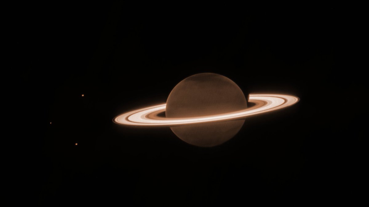 Saturn looks a bit different in Webb's infrared vision. Its extremely dark appearance is due to methane gas absorbing almost all of the sunlight falling on the atmosphere — contrasting its bright, icy rings. Download & learn more: webbtelescope.org/contents/media…