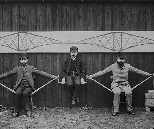 Project engineers demonstrate cantilever principles of the theForth Bridge in Scotland, 1887