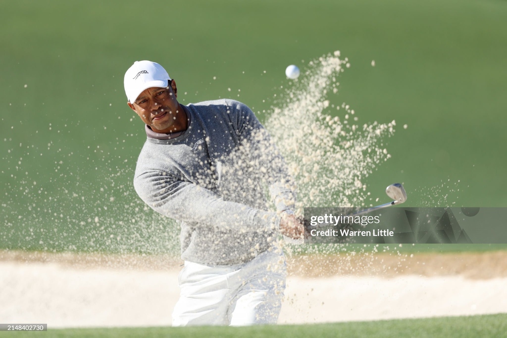 Tiger Woods of the #UnitedStates plays a shot from a bunker on the 18th hole during the continuation of the first round of the #2024MastersTournament at #AugustaNationalGolfClub in #Georgia. 📸: @Wazza_Little #GettySport #Golf #themasters @themasters