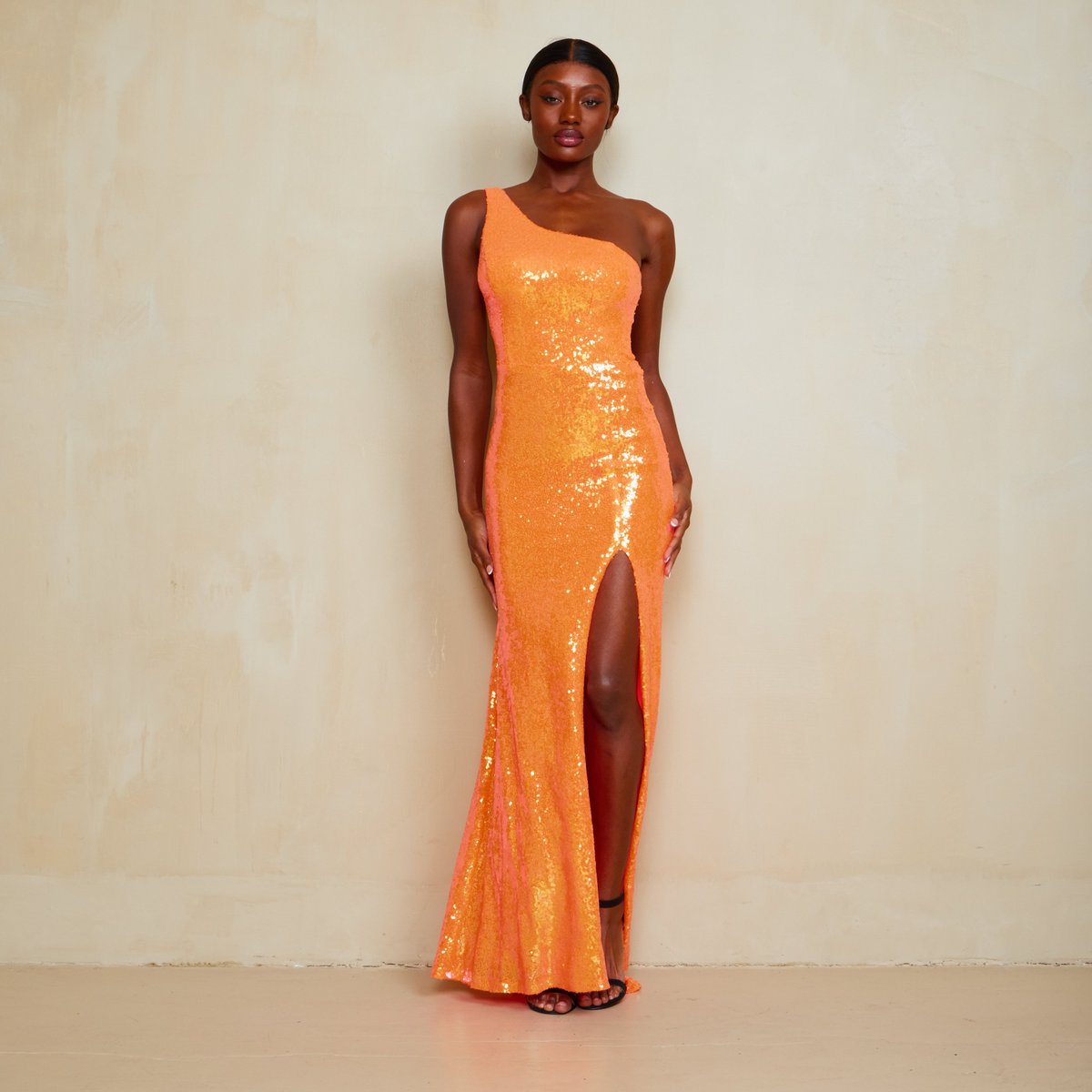 Now is your time to shine! Make a statement at prom this year in this gorgeous one shoulder orange sequin dress from B. Darlin! Shop now: tinyurl.com/2bzdw3mw