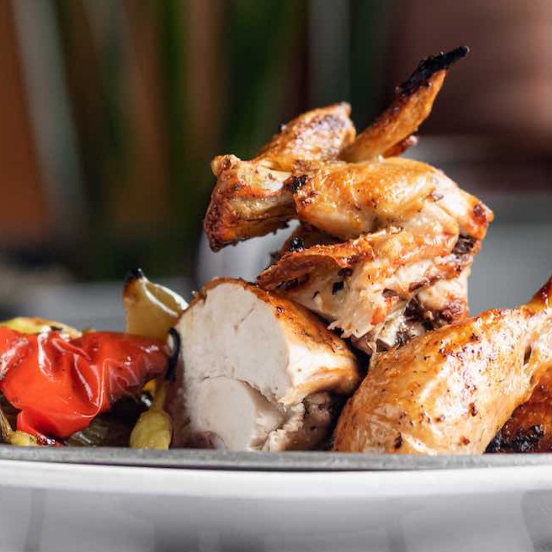Feast your eyes on this whole spit-roasted chicken – crispy, golden, and ready to tantalize your taste buds!