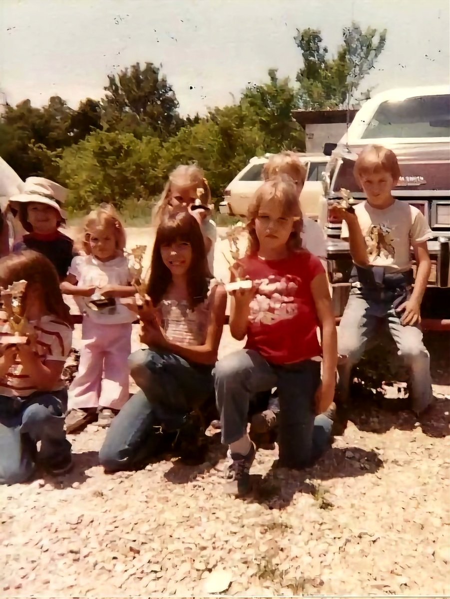 I'm in the far left corner with three of my sisters. We had all competed in a kids' fishing tournament that day. I had a stringer full of bass, catfish, and bluegill. Good times!