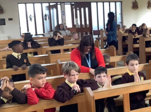 A lovely picture of our children in the chapel reflecting on the stations of the cross as part of their RE topic.