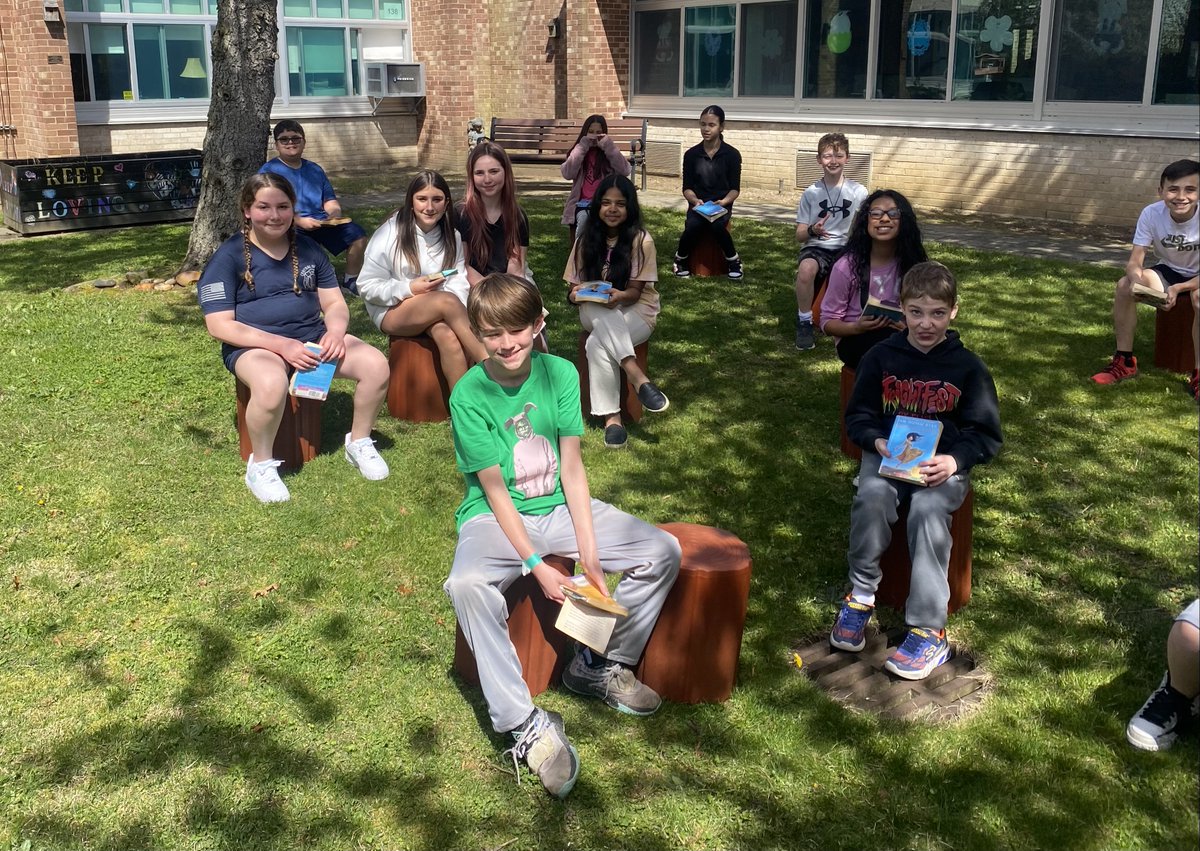 Mr. Cavanagh’s 5th grade class at Cherokee Street took advantage of yesterday's gorgeous weather! Their class seized the opportunity to utilize the school's courtyard, complete with the delightful new "tree stump" chairs, to engage in a reading session of their classroom novel.